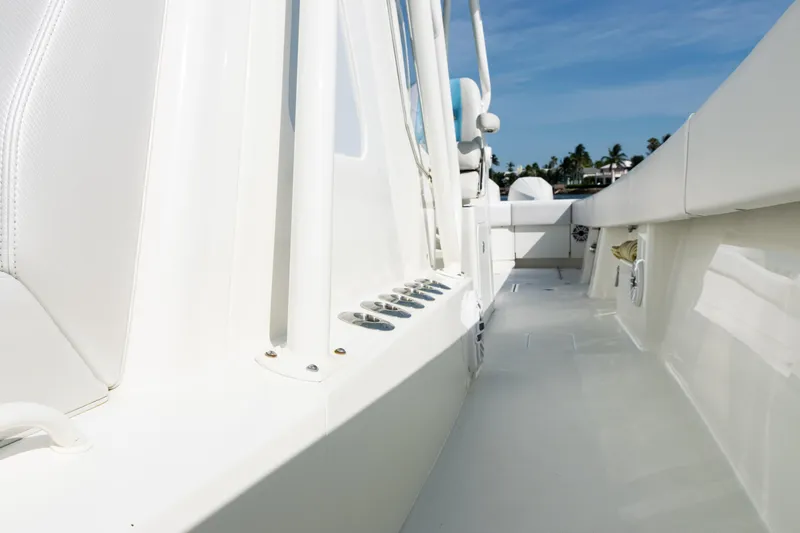  Yacht Photos Pics 2021 SeaVee 390 boat deck with white seating and clear blue sky.