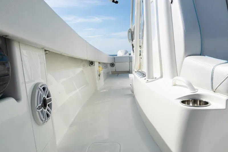  Yacht Photos Pics 2021 SeaVee 390 boat interior with white seating and cup holder, showcasing sleek design.