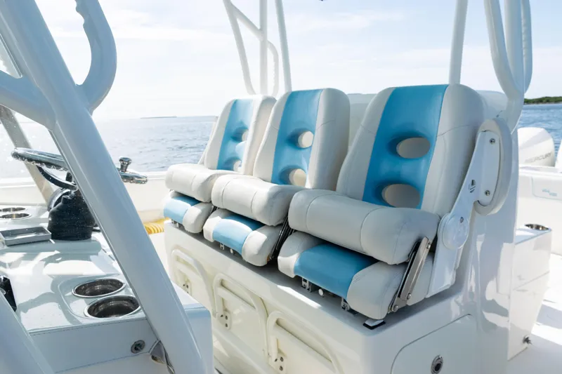  Yacht Photos Pics 2021 SeaVee 390 boat interior with blue and white seating, ocean view.