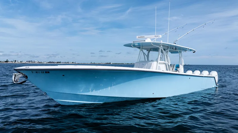  Yacht Photos Pics 2021 SeaVee 390 boat on calm ocean waters under a clear blue sky.