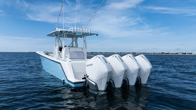  Yacht Photos Pics 2021 SeaVee 390 boat with four Mercury outboard engines on open water.