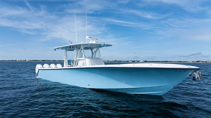  Yacht Photos Pics 2021 SeaVee 390 boat on calm ocean waters under a clear blue sky.