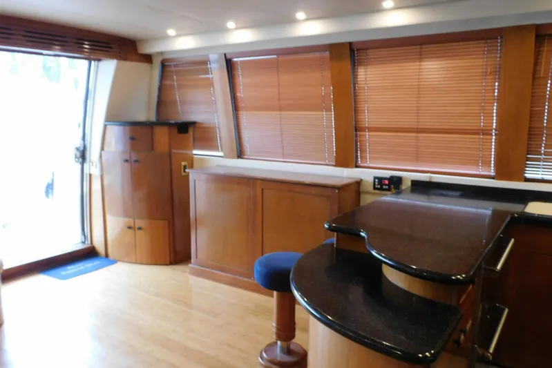 Waterdog Yacht Photos Pics Luxurious interior of 2002 Carver 570 Voyager Pilothouse with wood finishes and modern design.