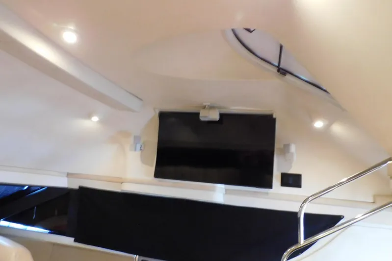 Waterdog Yacht Photos Pics Interior of 2002 Carver 570 Voyager Pilothouse with modern TV and lighting.