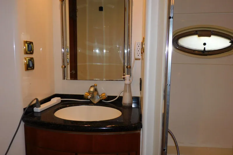 Waterdog Yacht Photos Pics Luxurious bathroom in 2002 Carver 570 Voyager Pilothouse yacht with elegant fixtures.