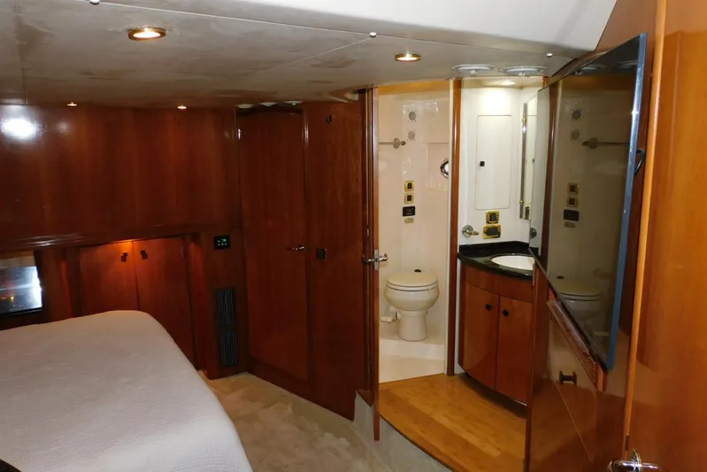 Waterdog Yacht Photos Pics Luxurious bathroom interior of 2002 Carver 570 Voyager Pilothouse yacht with wood finishes.