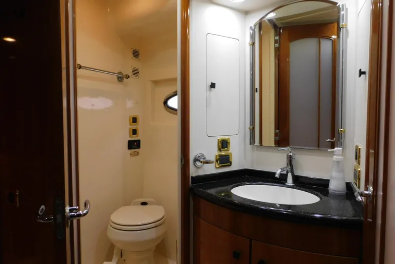 Waterdog Yacht Photos Pics Luxurious bathroom in 2002 Carver 570 Voyager Pilothouse yacht with modern amenities.