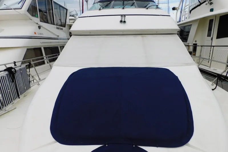 Waterdog Yacht Photos Pics 2002 Carver 570 Voyager Pilothouse yacht deck with blue cover.