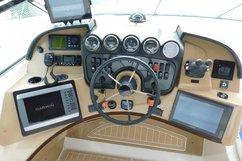 Waterdog Yacht Photos Pics Pilothouse of 2002 Carver 570 Voyager with Garmin navigation and control instruments.