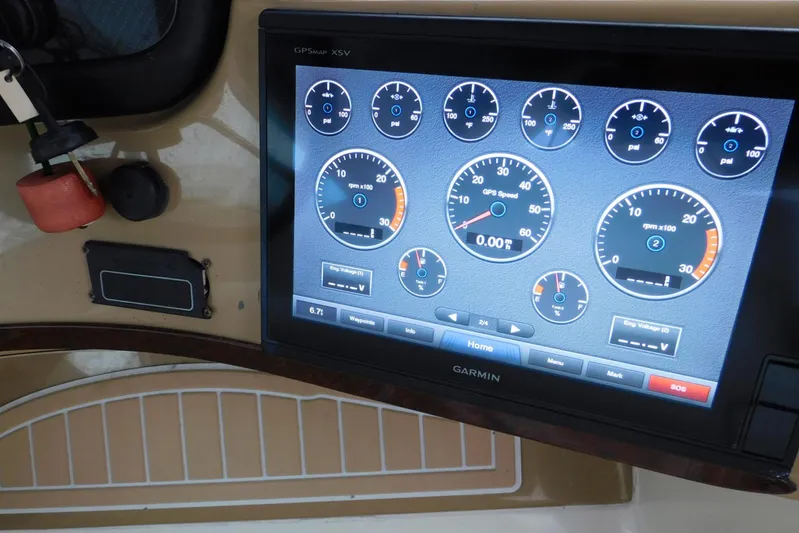 Waterdog Yacht Photos Pics Garmin GPS display on 2002 Carver 570 Voyager Pilothouse dashboard, showing various gauges.