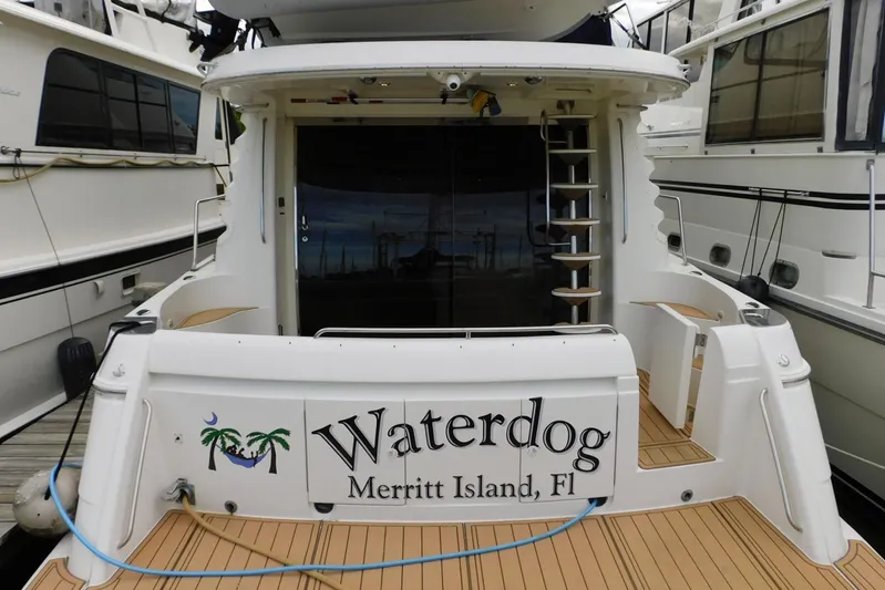 Waterdog Yacht Photos Pics 2002 Carver 570 Voyager Pilothouse yacht docked, named "Waterdog," Merritt Island, Florida.