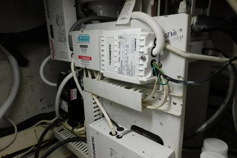 Waterdog Yacht Photos Pics Electrical system inside 2002 Carver 570 Voyager Pilothouse, featuring Dometic components and wiring.