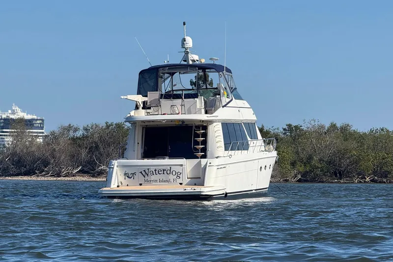 Waterdog Yacht Photos Pics 2002 Carver 570 Voyager Pilothouse yacht on water near Merritt Island, Florida.