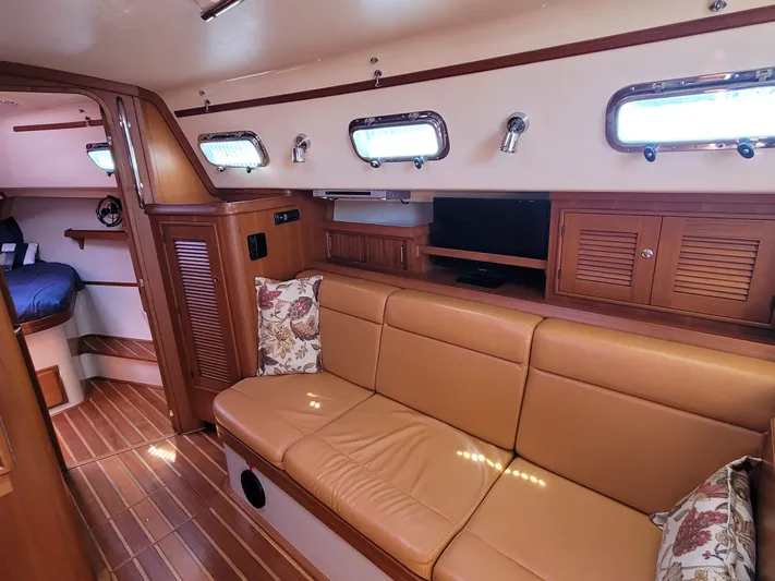Mango Lll Yacht Photos Pics Luxurious interior of 2006 Island Packet 370 yacht with leather seating and wood accents.