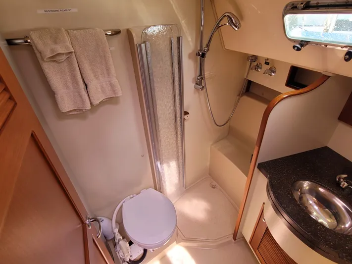 Mango Lll Yacht Photos Pics Bathroom interior of 2006 Island Packet 370 yacht with shower, sink, and toilet.