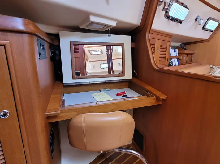 Mango Lll Yacht Photos Pics Interior of 2006 Island Packet 370 sailboat with wooden desk and chair.