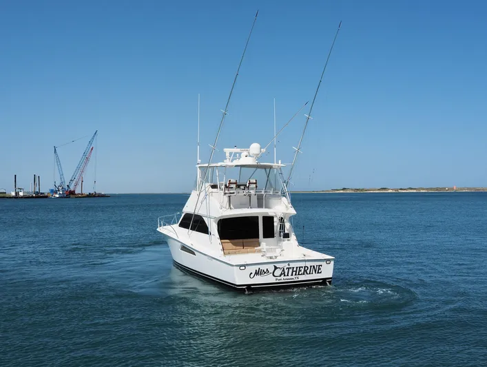  Yacht Photos Pics 2007 Viking Convertible yacht with mezzanine cruising in open water.