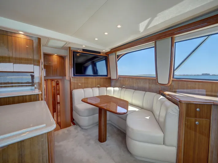  Yacht Photos Pics Luxurious 2007 Viking Convertible yacht interior with plush seating and elegant wood finishes.