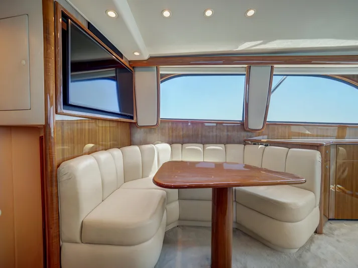  Yacht Photos Pics Luxurious 2007 Viking Convertible yacht interior with plush seating and elegant wood finishes.