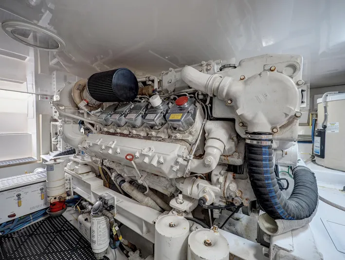  Yacht Photos Pics Engine room of 2007 Viking Convertible w/ Mezzanine, showcasing powerful marine engine components.