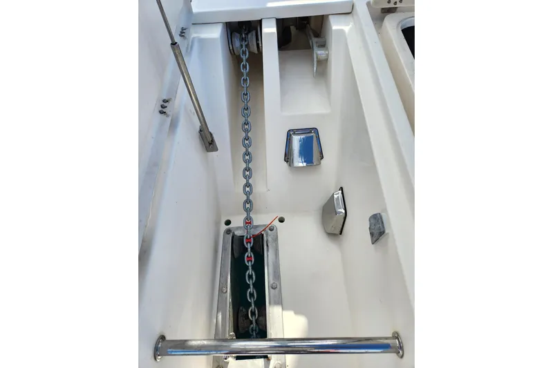 Leopard 46 Yacht Photos Pics Anchor chain compartment of 2009 Leopard 46 catamaran, featuring metal fittings and clean design.