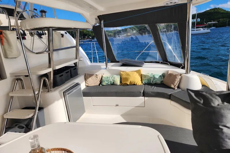 Leopard 46 Yacht Photos Pics 2009 Leopard 46 yacht interior with cushioned seating, ocean view, and modern design.