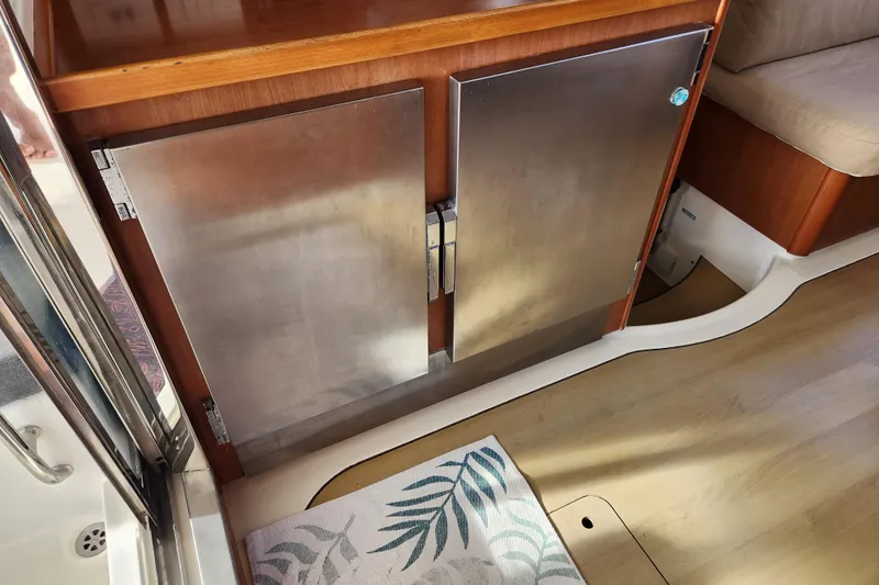 Leopard 46 Yacht Photos Pics Stainless steel cabinet doors on a 2009 Leopard 46 yacht interior.