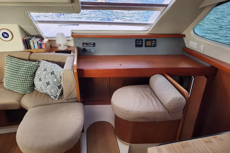 Leopard 46 Yacht Photos Pics Cozy interior of 2009 Leopard 46 yacht with seating, desk, and ocean view.