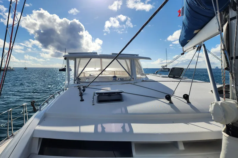 Leopard 46 Yacht Photos Pics 2009 Leopard 46 catamaran on open sea under blue sky with clouds.