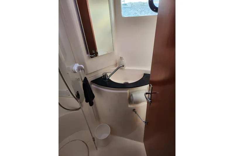 Leopard 46 Yacht Photos Pics Bathroom interior of 2009 Leopard 46 yacht with sink and mirror.