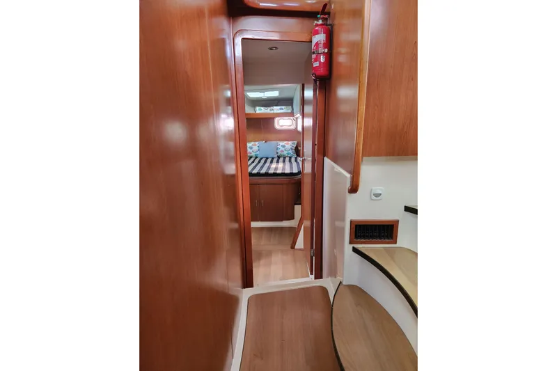 Leopard 46 Yacht Photos Pics Interior of 2009 Leopard 46 yacht with wooden finish and cozy cabin.