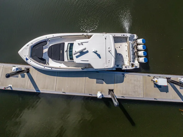 Jet Lag Yacht Photos Pics Aerial view of 2019 Boston Whaler 420 Outrage docked at a marina.