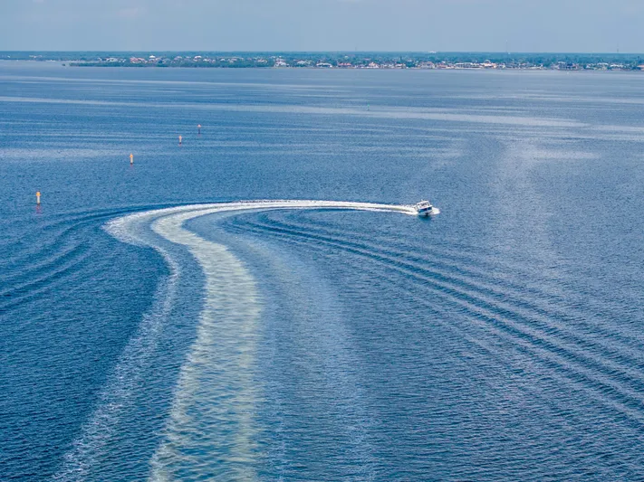 Jet Lag Yacht Photos Pics Aerial view of 2019 Boston Whaler 420 Outrage cruising on open water.