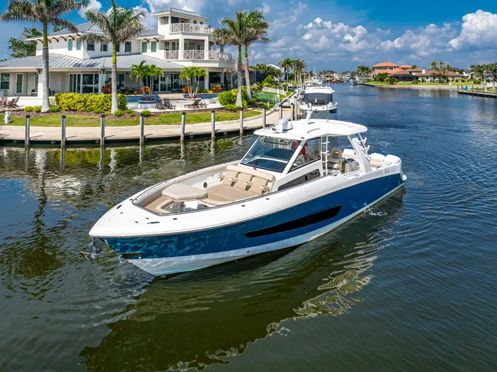 Jet Lag Yacht Photos Pics 2019 Boston Whaler 420 Outrage cruising in a scenic waterfront setting.