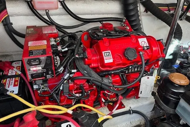  Yacht Photos Pics Engine compartment of a 2019 Monterey 355 Sport Yacht with red EFI engine components.