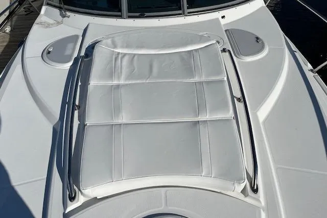  Yacht Photos Pics 2019 Monterey 355 Sport Yacht sunpad on deck, featuring sleek white design.