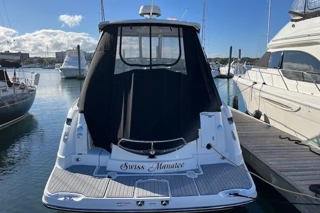  Yacht Photos Pics 2019 Monterey 355 Sport Yacht docked, rear view with black cover, sunny marina setting.