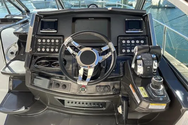  Yacht Photos Pics Cockpit of 2019 Monterey 355 Sport Yacht with modern steering and controls.
