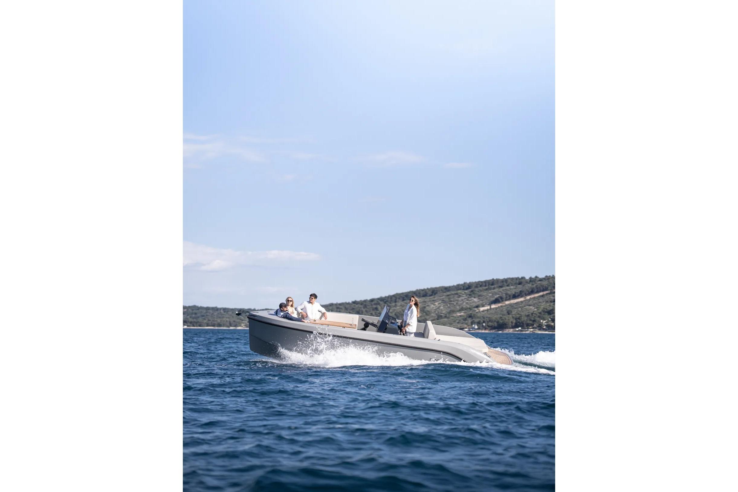 2023 Rand PLAY 24 boat cruising on open water with passengers enjoying the ride.