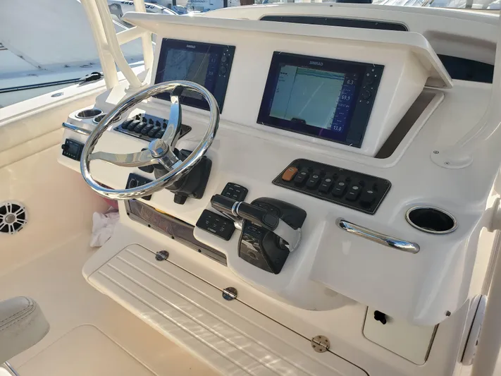  Yacht Photos Pics Helm console of a 2017 Grady-White Canyon 336 boat.