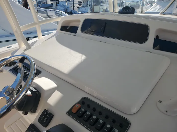  Yacht Photos Pics Helm console of a 2017 Grady-White Canyon 336 boat in harbor.
