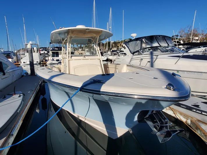  Yacht Photos Pics 2017 Grady-White Canyon 336 boat docked at marina under clear blue sky.