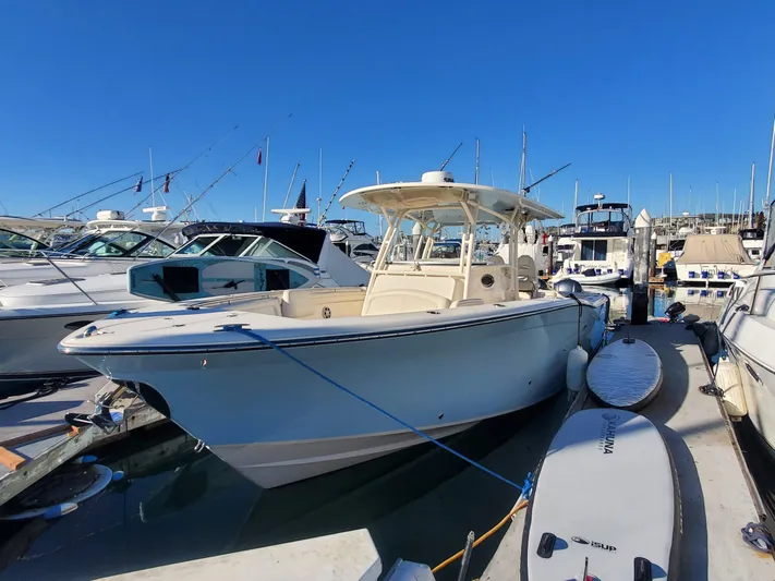  Yacht Photos Pics 2017 Grady-White Canyon 336 boat docked at marina under clear blue sky.