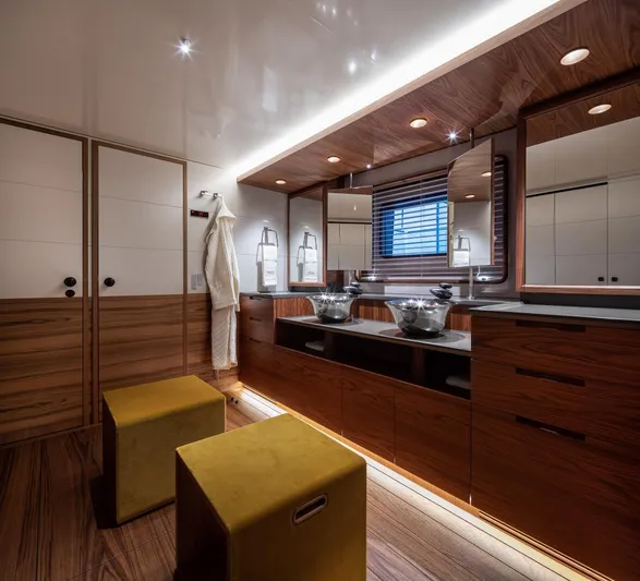 Canova Yacht Photos Pics Luxurious yacht bathroom with wooden accents, dual sinks, and modern lighting, Baltic 2019 model.