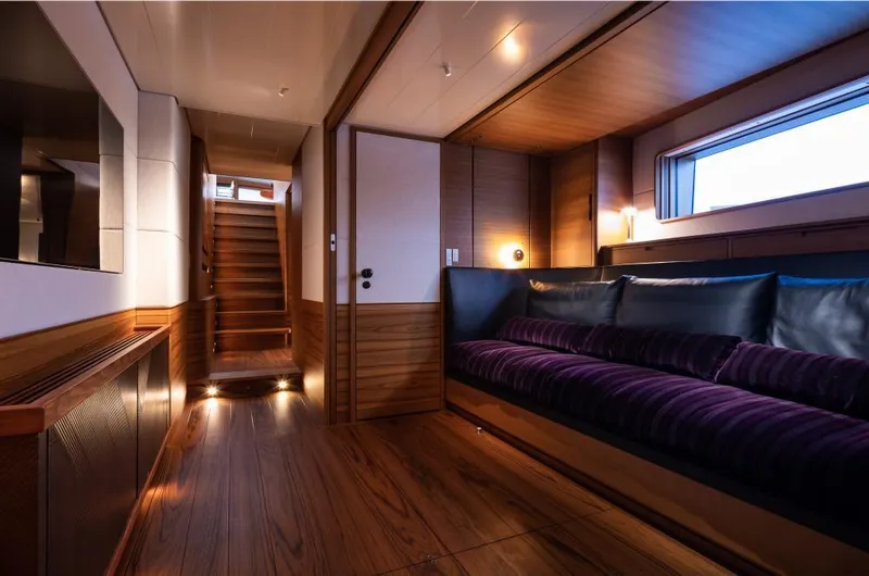 Canova Yacht Photos Pics Luxurious interior of 2019 Baltic Light Displacement Sailing Yacht with wooden flooring and plush seating.