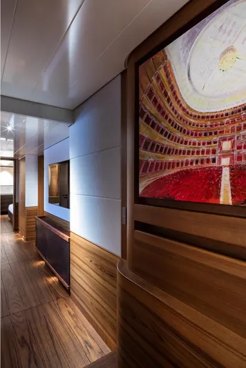 Canova Yacht Photos Pics Luxurious interior of 2019 Baltic sailing yacht with elegant wood paneling and vibrant artwork.