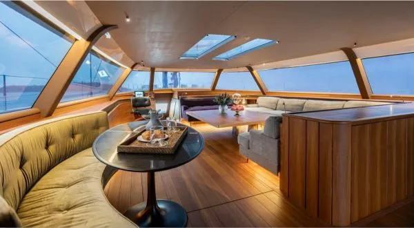 Canova Yacht Photos Pics Luxurious interior of 2019 Baltic Light Displacement Sailing Yacht with elegant seating and dining area.