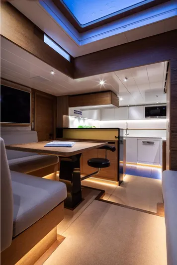 Canova Yacht Photos Pics Luxurious interior of 2019 Baltic Light Displacement Sailing Yacht with modern kitchen and seating area.