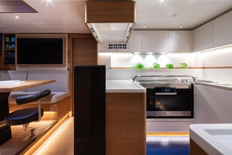 Canova Yacht Photos Pics Luxurious interior of 2019 Baltic Light Displacement Sailing Yacht with modern kitchen and seating area.