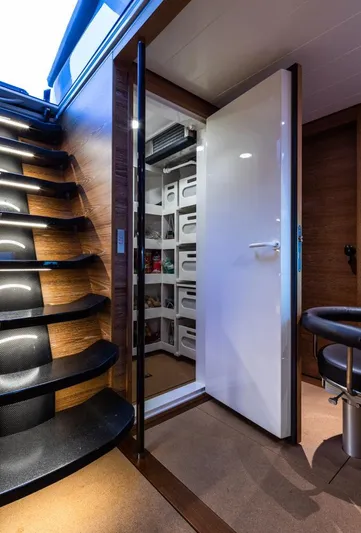 Canova Yacht Photos Pics Interior of 2019 Baltic Light Displacement Sailing Yacht with modern staircase and storage area.